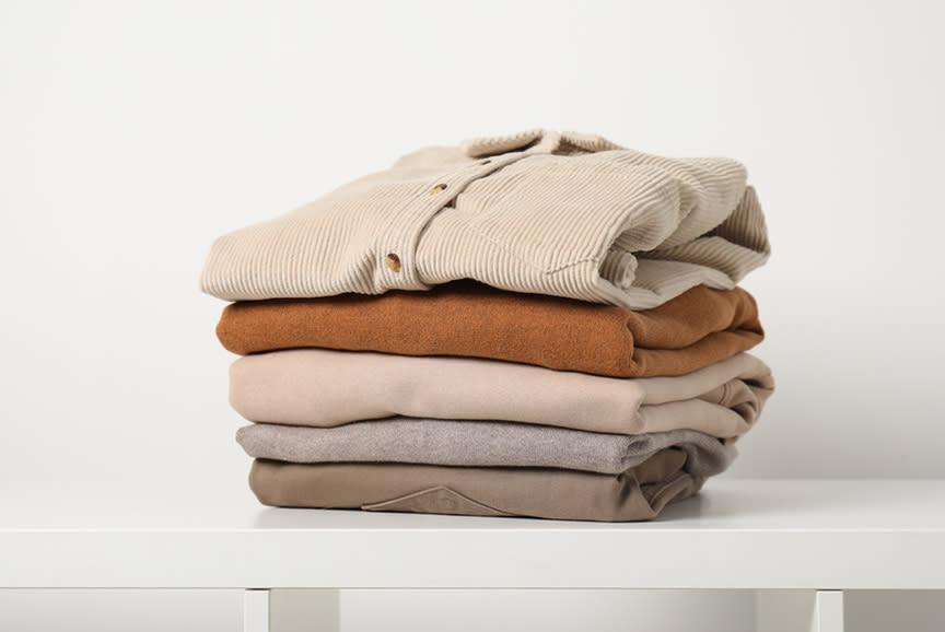 eatly folded stack of sweaters and clothing