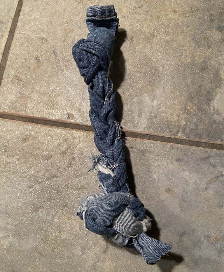 DIY dog toy made with strips of braided denim jeans from the Thrift Store