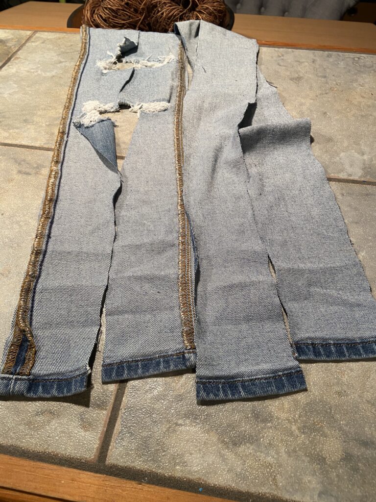 Cut the jeans into 4 strips