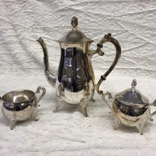 Silver coffee and tea set - Affordable & sustainable holiday outfits with style guide