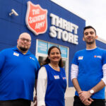 Thrift Store employees smiling and standing outside one of our locations