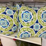 outdoor summer patio cushions on rack at the thrift store
