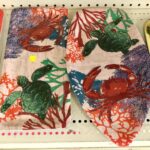 decorative summer servingware with an underwater scene of turtles, lobsters, and coral
