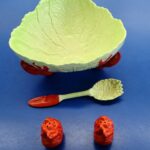 decorative serving set with bowl, forked spoon and salt and pepper shakers featuring lobster and lettuce details