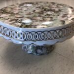 vintage floral cake stand with intricate detailing for patio serving