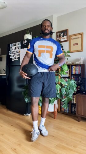 David wearing thrifted jersey and shorts