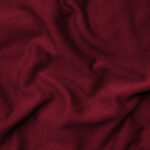 Impact report close-up photo of rippled red fabric