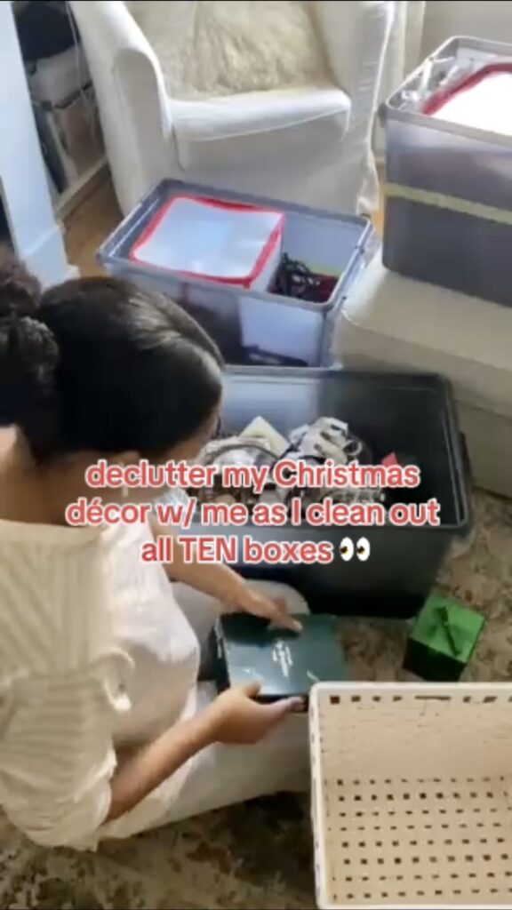 person organizing and decluttering their holiday décor