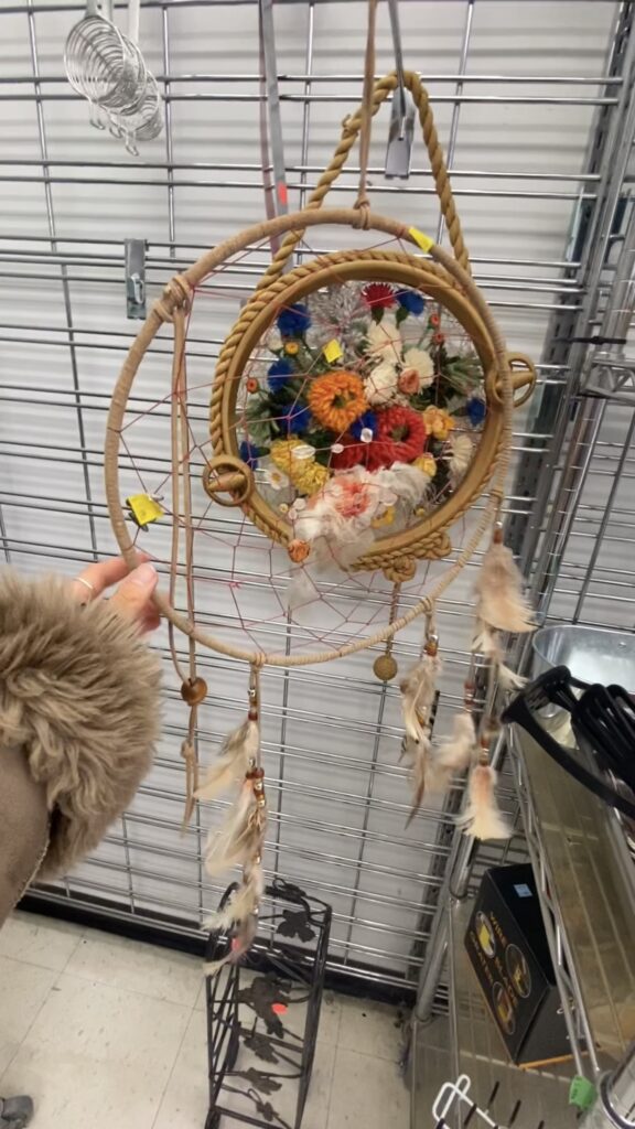 Dreamcatcher hanging on rack at Thrift Store