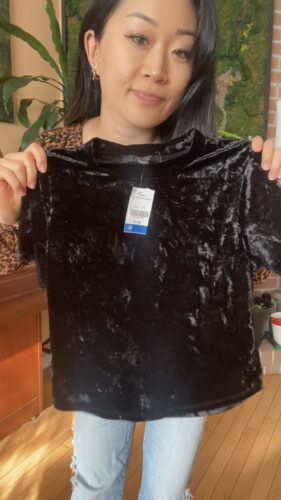 $42 Try-on Thrift Haul: Anna holding velvet shirt find