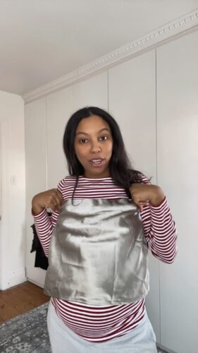 Nicole holding up thrifted Zara tube top | maternity try-on haul
