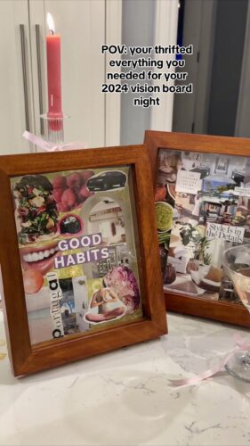 Vanessa shows off thrifted items for her 2024 Vision Board: magazines, scissors, scrapbook paper, a vintage picture frame, glue sticks, candles, glassware, and ribbons.