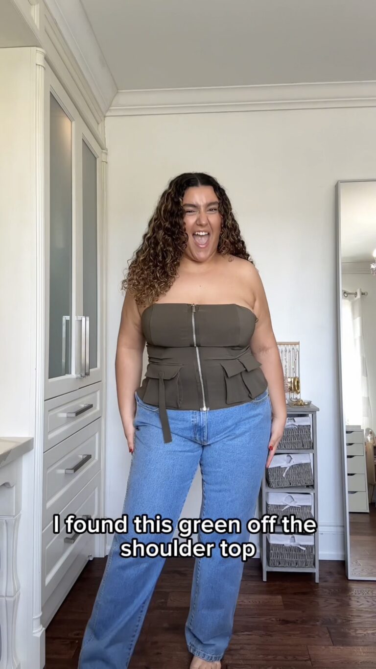 Vanessa trying on green off shoulder top