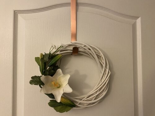 Finished DIY spring wreath hanging on door