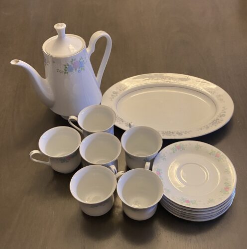 Thrifted tea set with cups, teapot and plates
