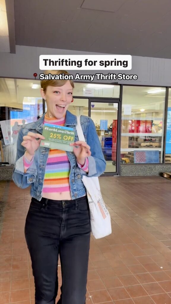 Jade outside of Thrift Store holding coupon