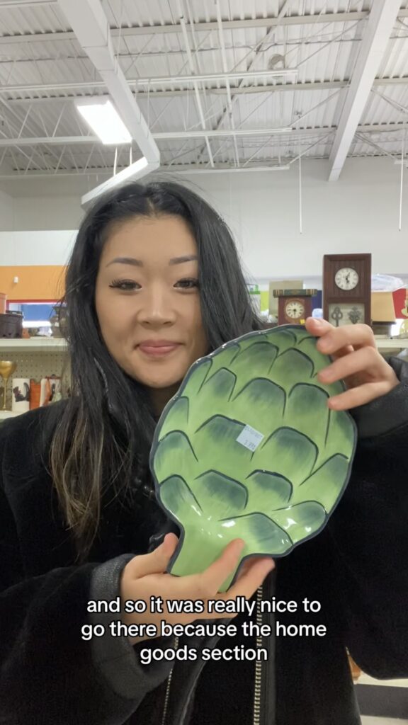 Anna holding vegetable pottery plate