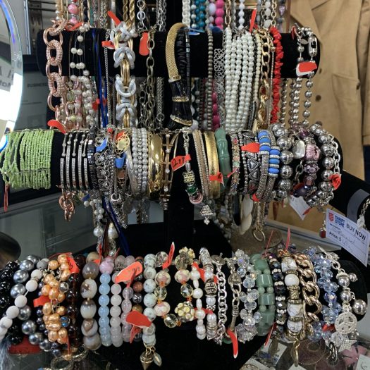 Bracelets hanging on display in Thrift Store