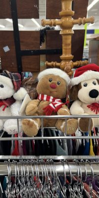 Polar bear plushie wearing a santa hat and scarf, ginerbread man plushie wearing a santa hat and scarf, dog plushie wearing santa hat and scarf